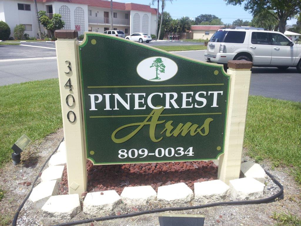 Pinecrest arms sign